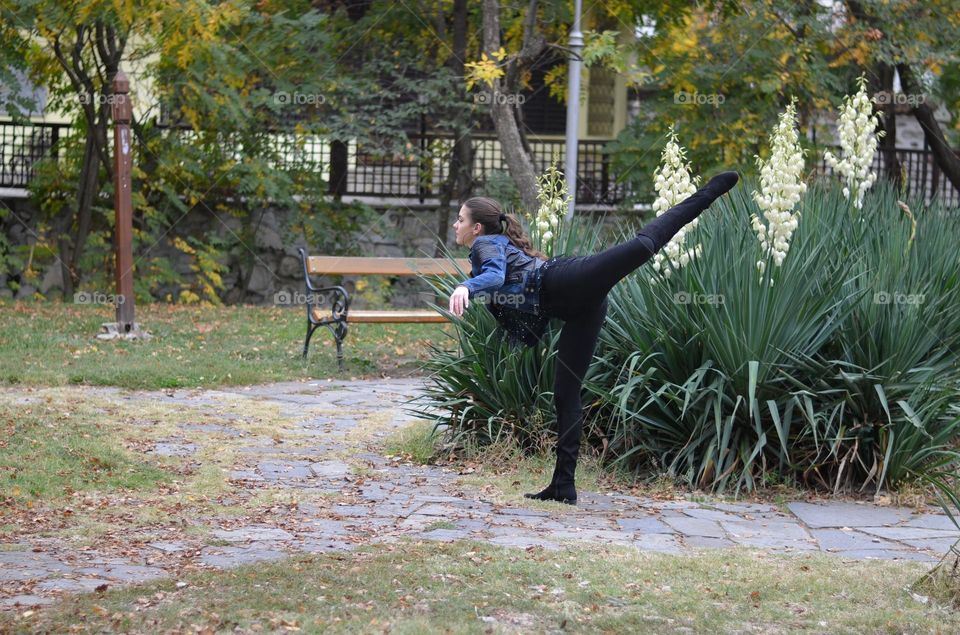 Beautiful Young Girl Dancing Outside in Nature