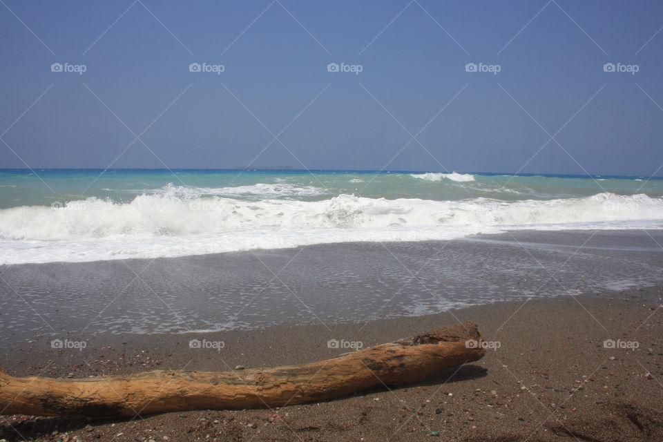 High waves on an isolated sandy beach on Rhodes island, Greece