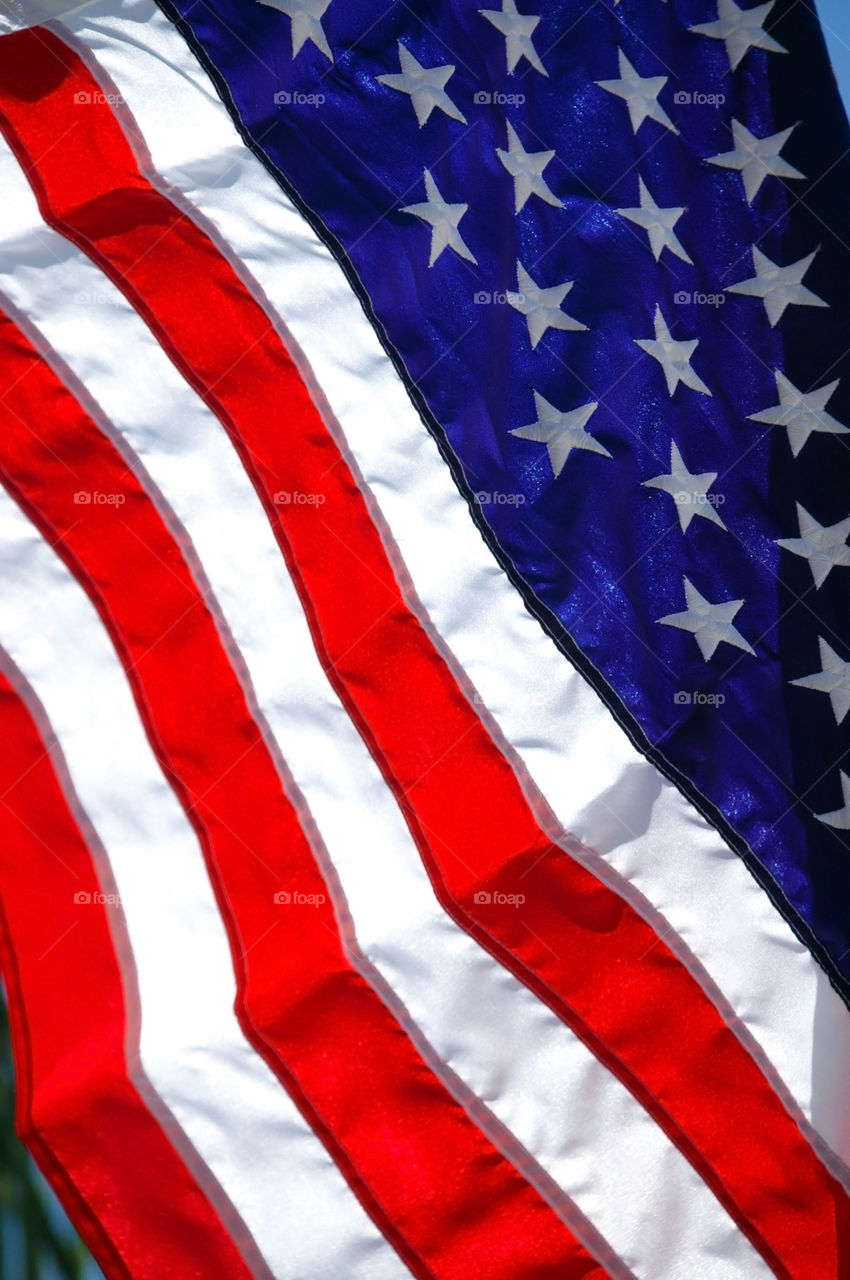 Light shining through an American flag. 