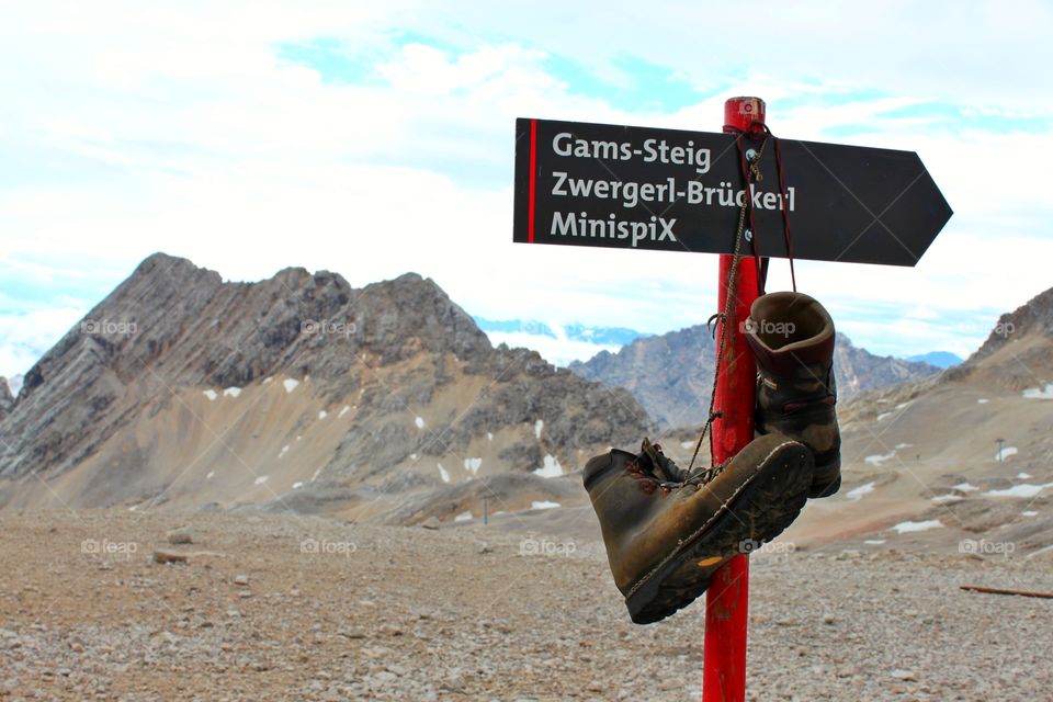 view of the mountains of Austria the Alps and the red signpost