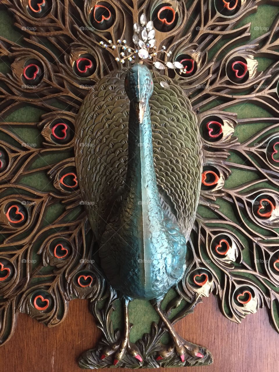 Painted Peacock woodcarving.