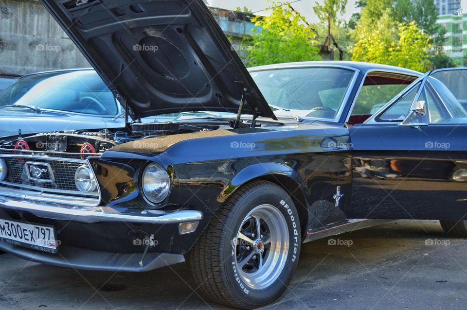 ford mustang with open hood for repair