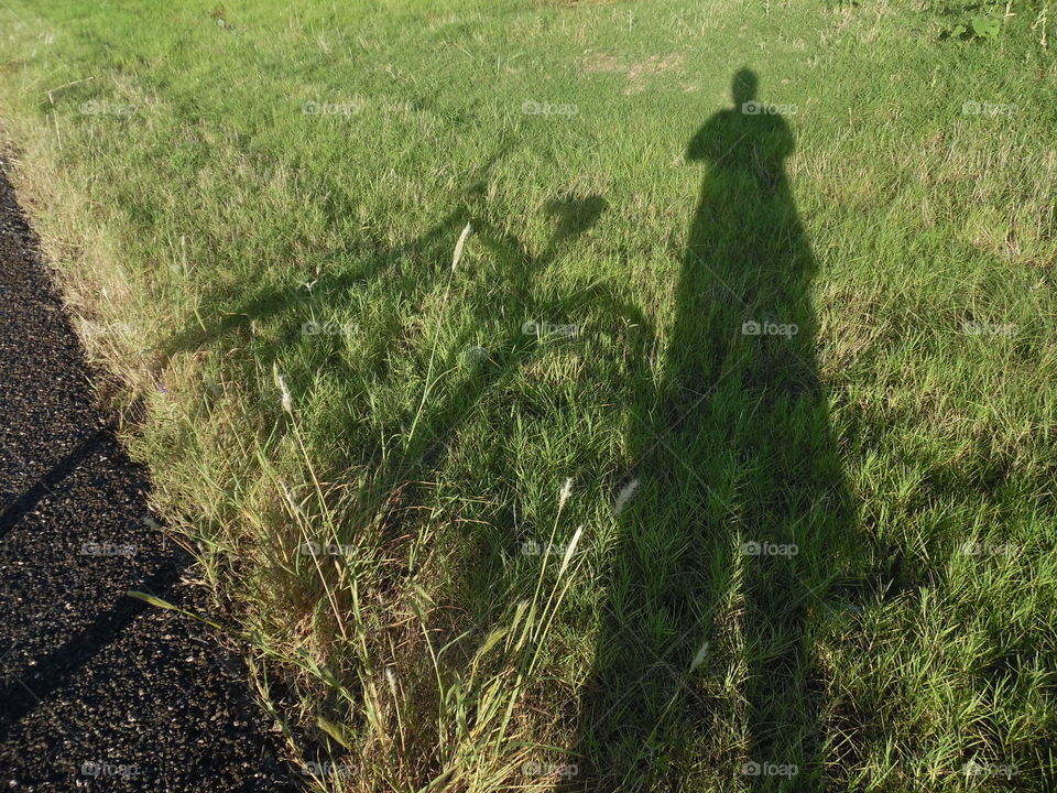 shadow 👨 man. This is a picture of my shadow that I saw while out riding my bike 🚲 this weekend