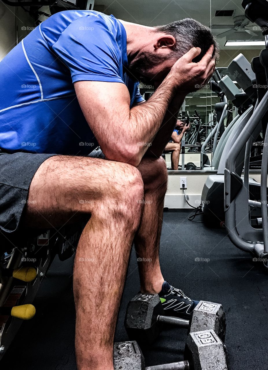 Man sitting in gym