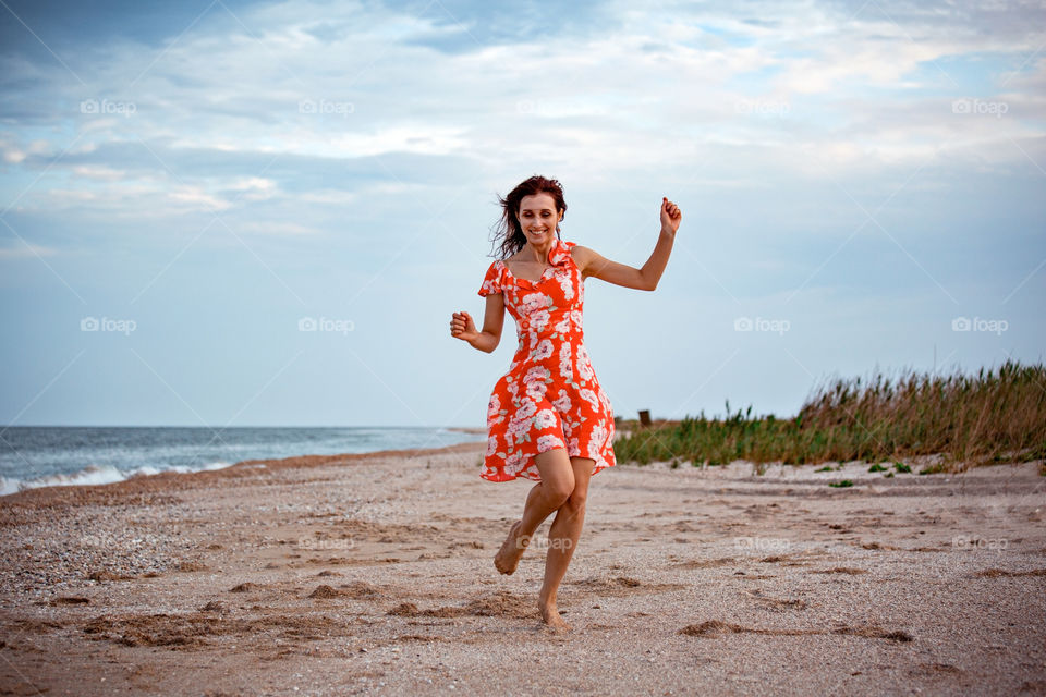 young girl dancing on the beach