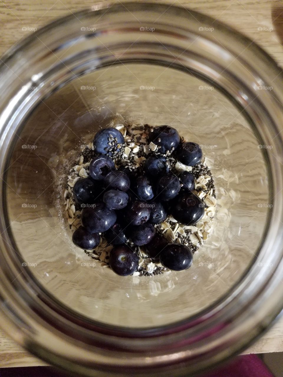 blueberries in a mason jar for breakfast with oats. overnight oats for a grab and go breakfast.