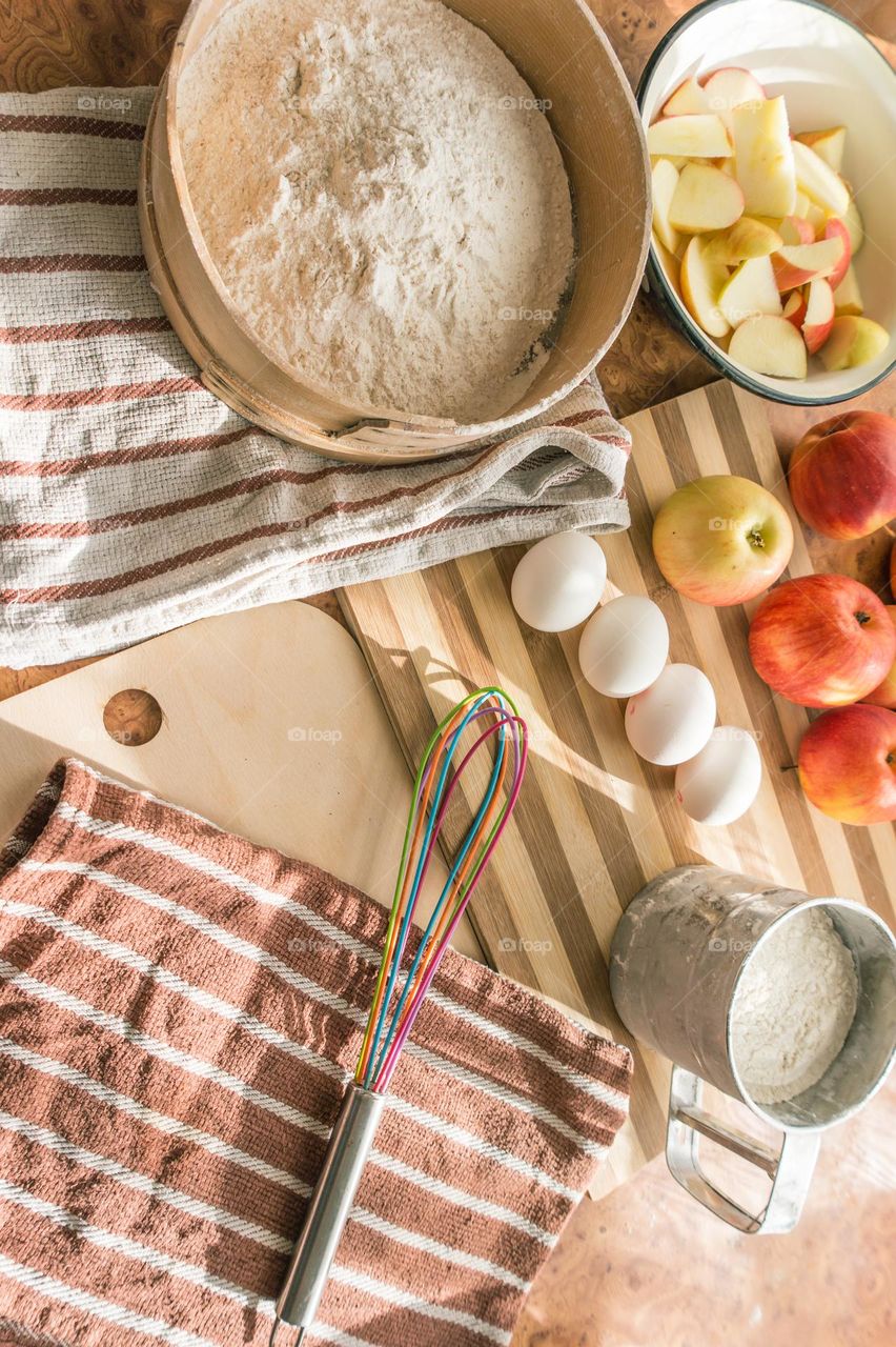 Making homemade puffed apple pie with eggs, sugar and flour.