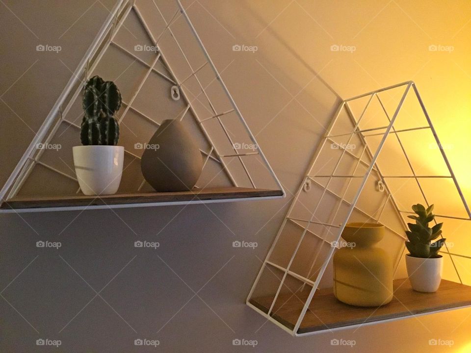 Triangular plant holders - Geometry is a type of math that deals with points, lines, shapes, and surfaces.
Examples are Circles, Rectangles, and Triangles. 