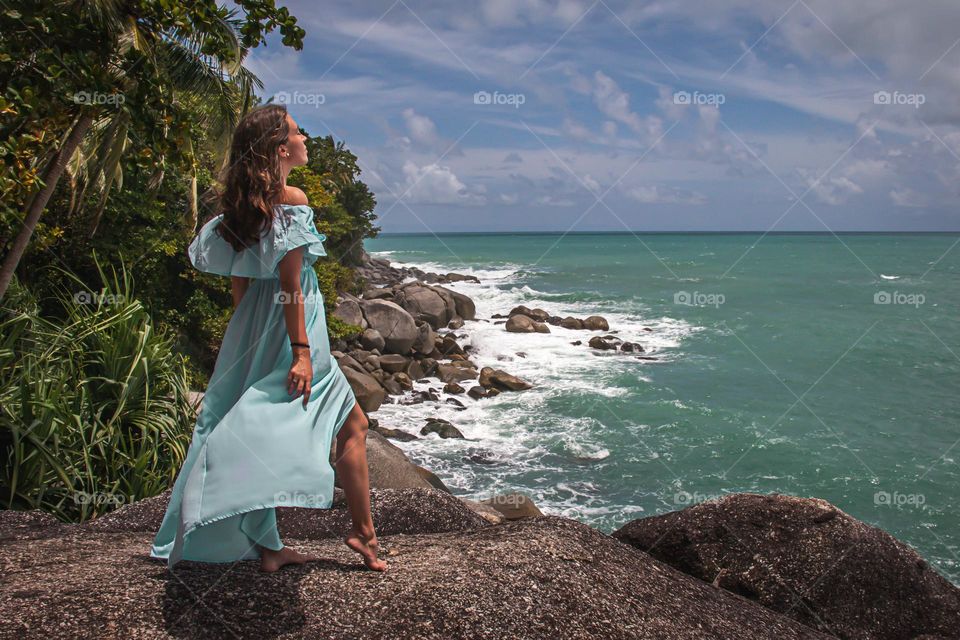 Young woman enjoying the view of the sea