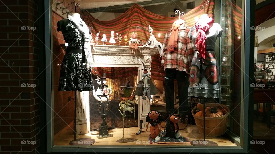 Halloween Shop Window Display, Fall Fashion for Men and Women. Pumpkins and Autumn Leaves