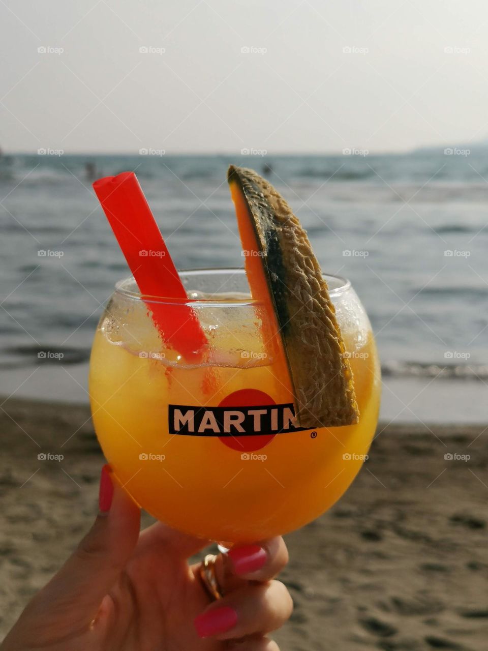 Nice summer day on the beach with tasty cocktail. Relax and enjoy your time.