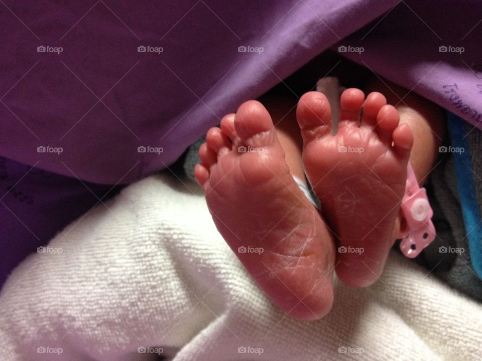 Feet of a recently born baby