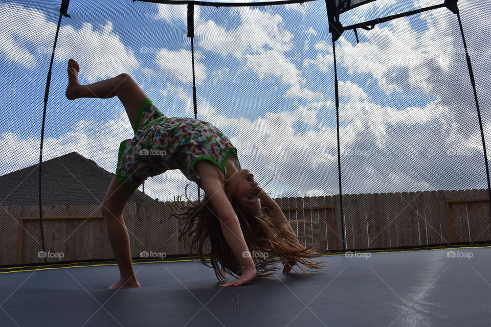 Young woman exercise on trampoline
