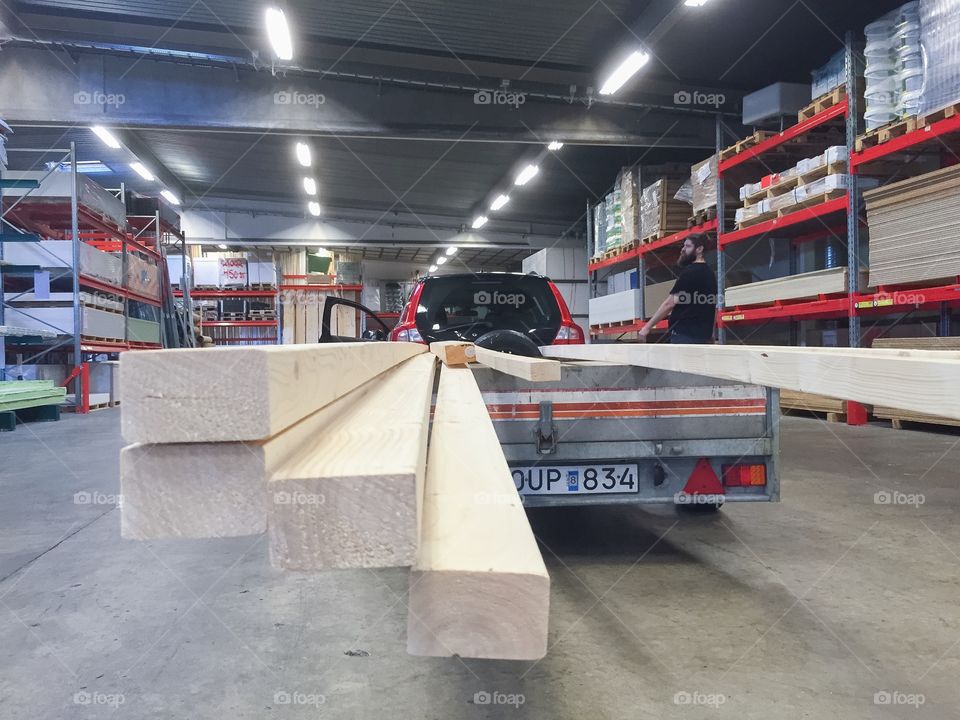 Shopping wood for house building.