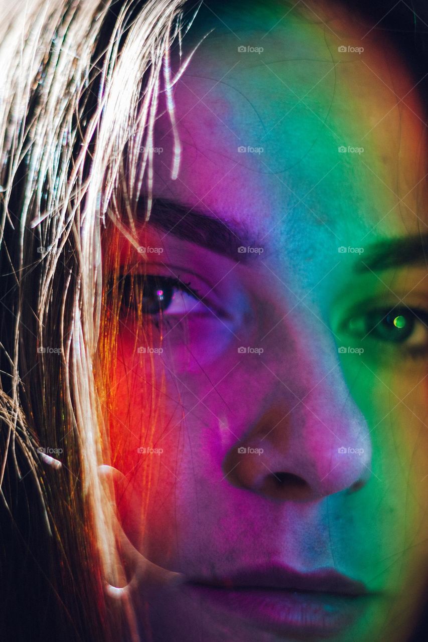 woman with a rainbow on her face