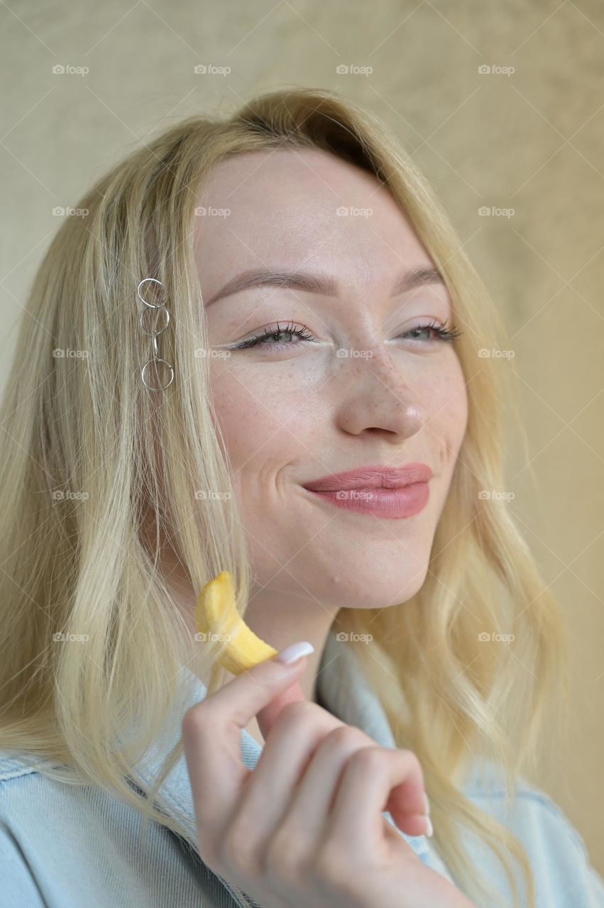 Portrait of a cute girl with blonde hair with a good look
