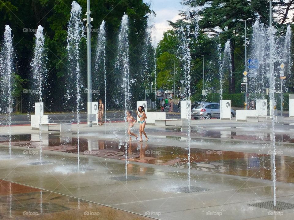 Girl playing at United Nation. Girl playing with water at United Nation Geneva