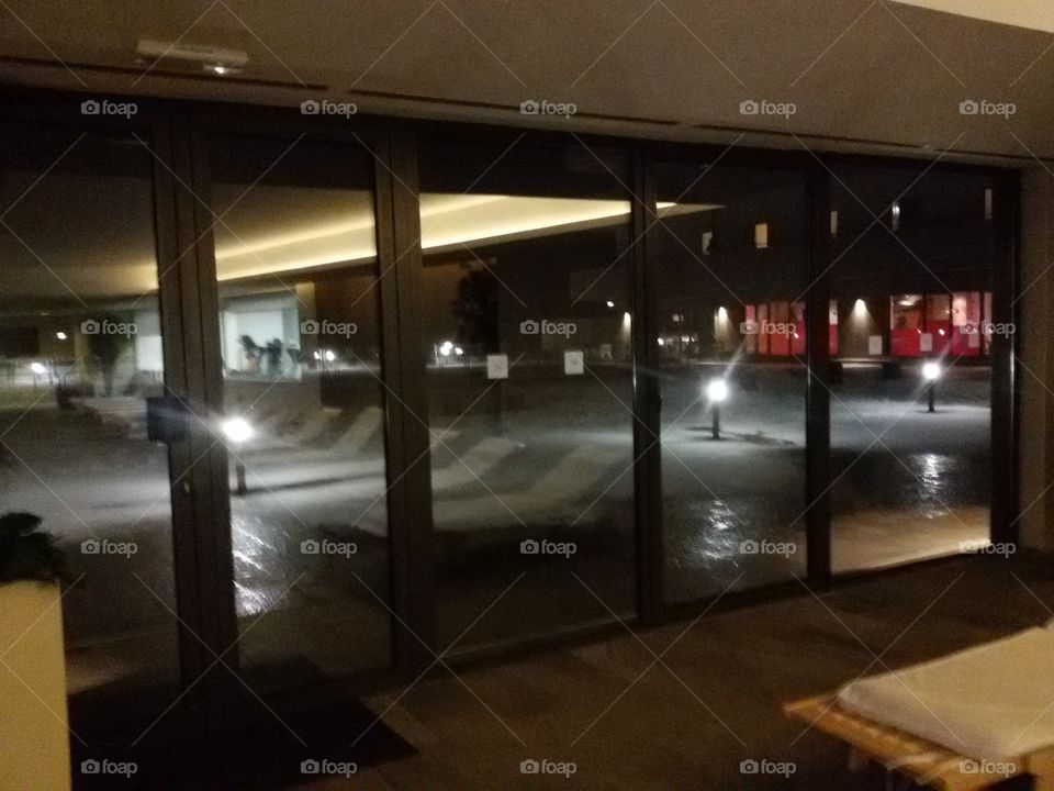 view from the indoor hotel pool to the snow outside