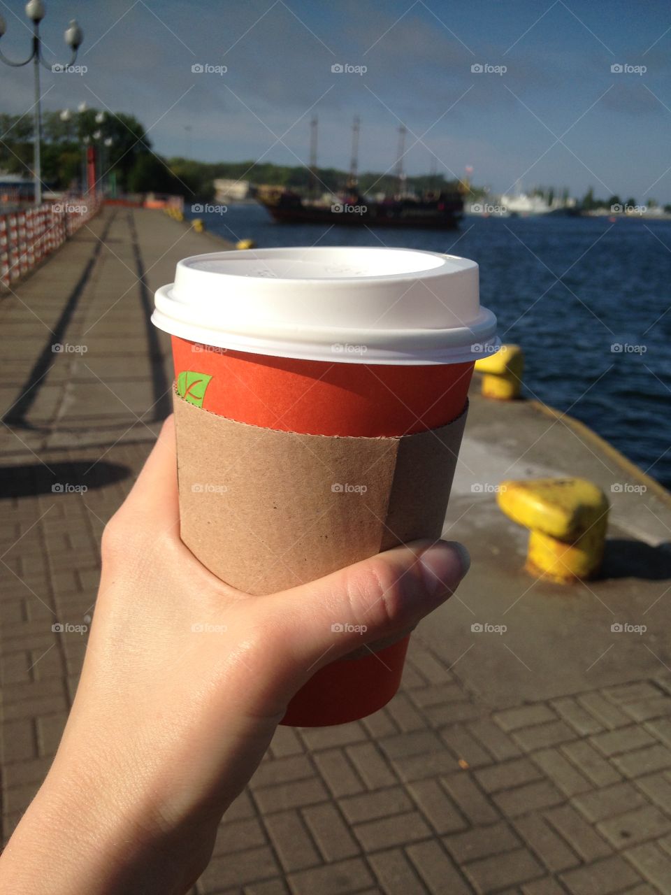 Drinking coffee in the sea port 