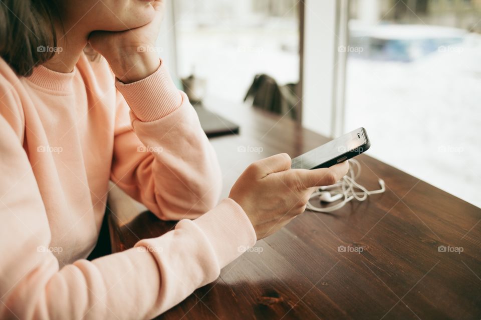 Woman holding mobile phone