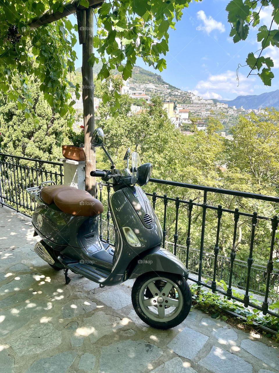 Black scooter at the mountains background 