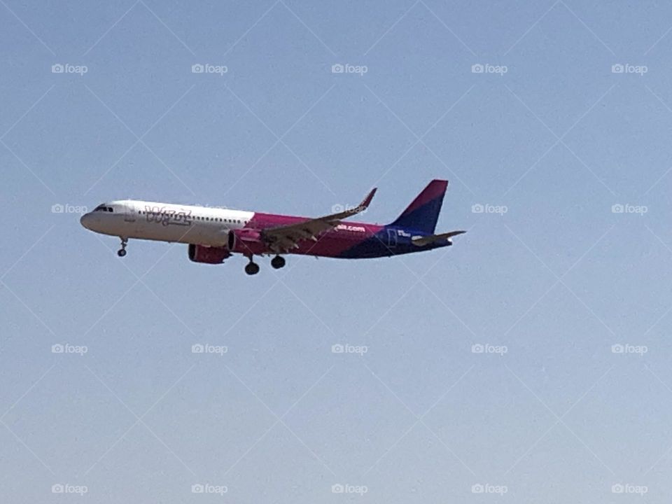 beautiful aircraft flying cross the blue sky