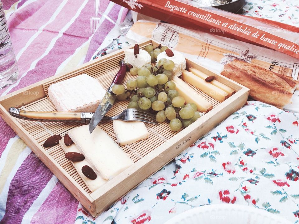 Plate of cheese. Plate of French cheese on a picnic mat