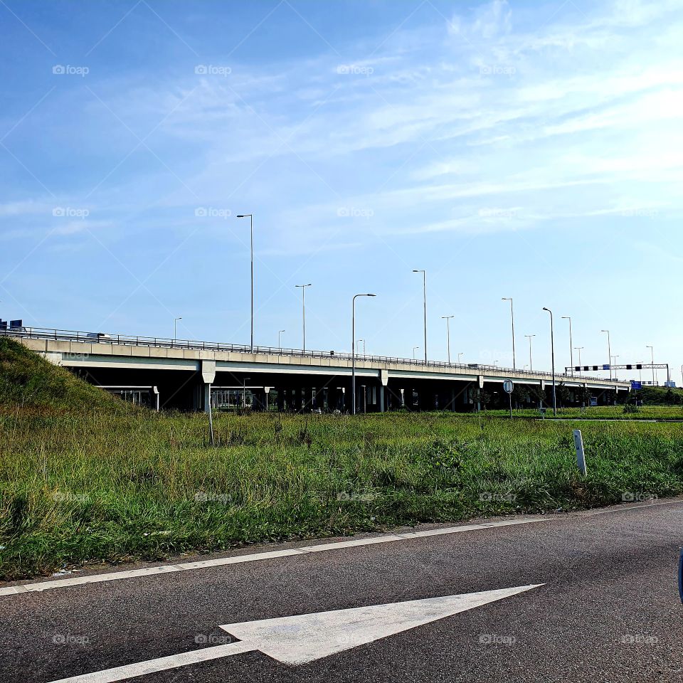 Along the highway of the A15, it passes above it. The Netherlands - Rotterdam.