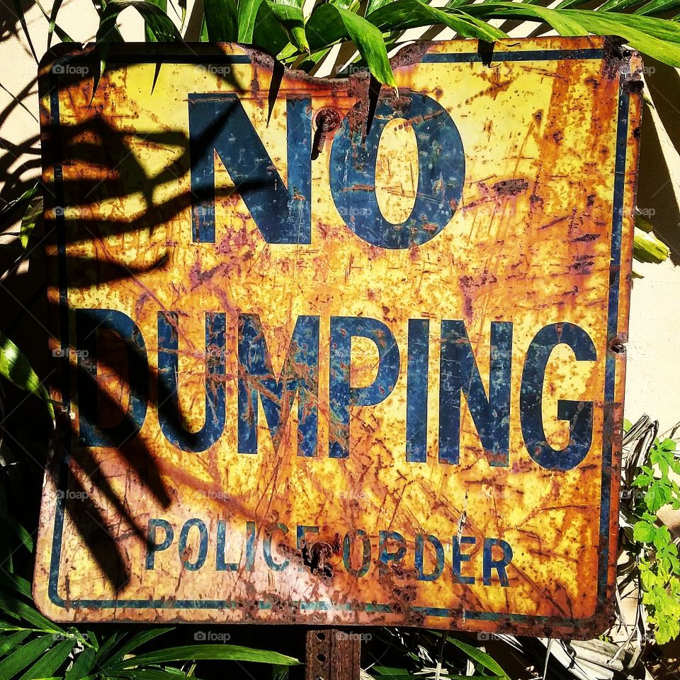 Weathered No Dumping Sign