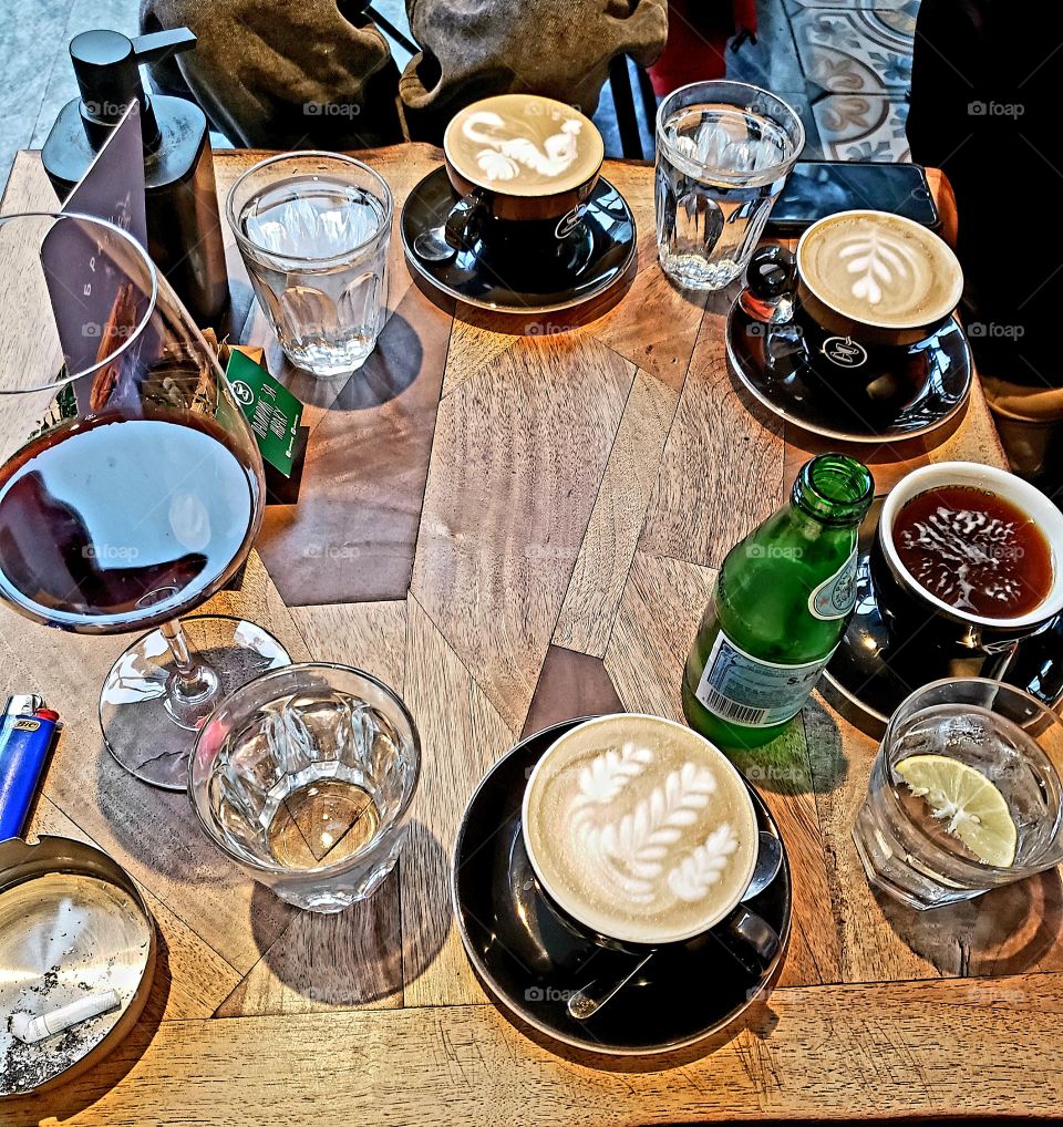 cappuccino and wine and water