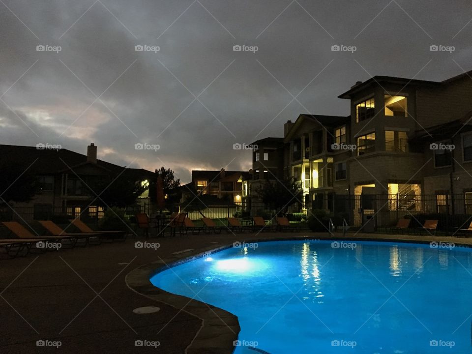 Beautiful local apartment pool at dusk. [TEST]