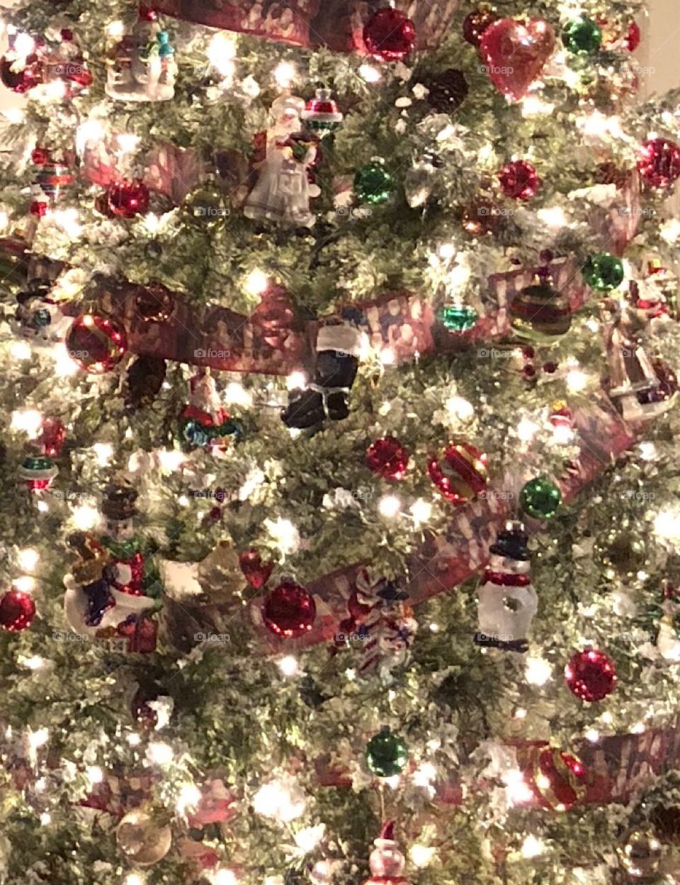 Decorated Christmas tree lights sparkly glass ornaments 