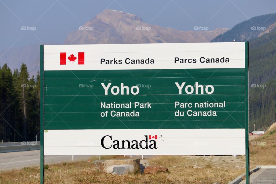 Togo national park sign, parks Canada sign on transcanada highway in Canada's Rocky Mountains with Rocky Mountains in background 