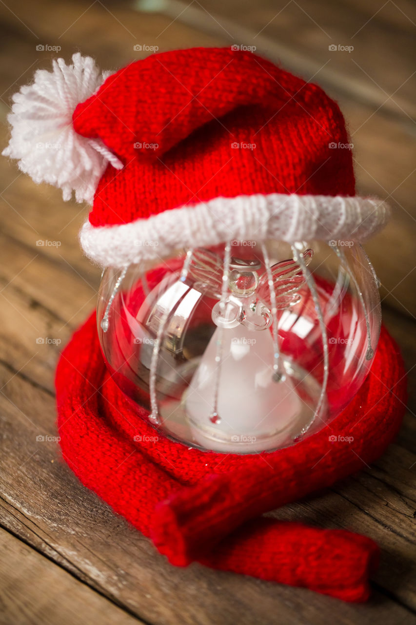 Close-up of Christmas gift with Santa hat