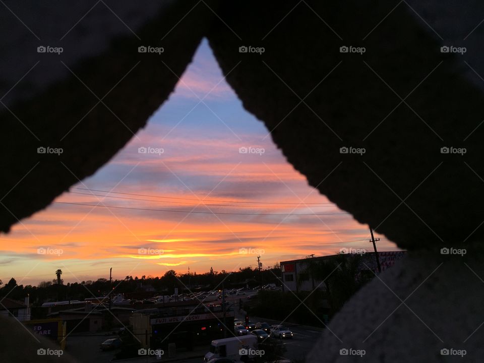Sunset through a brick lattice 2