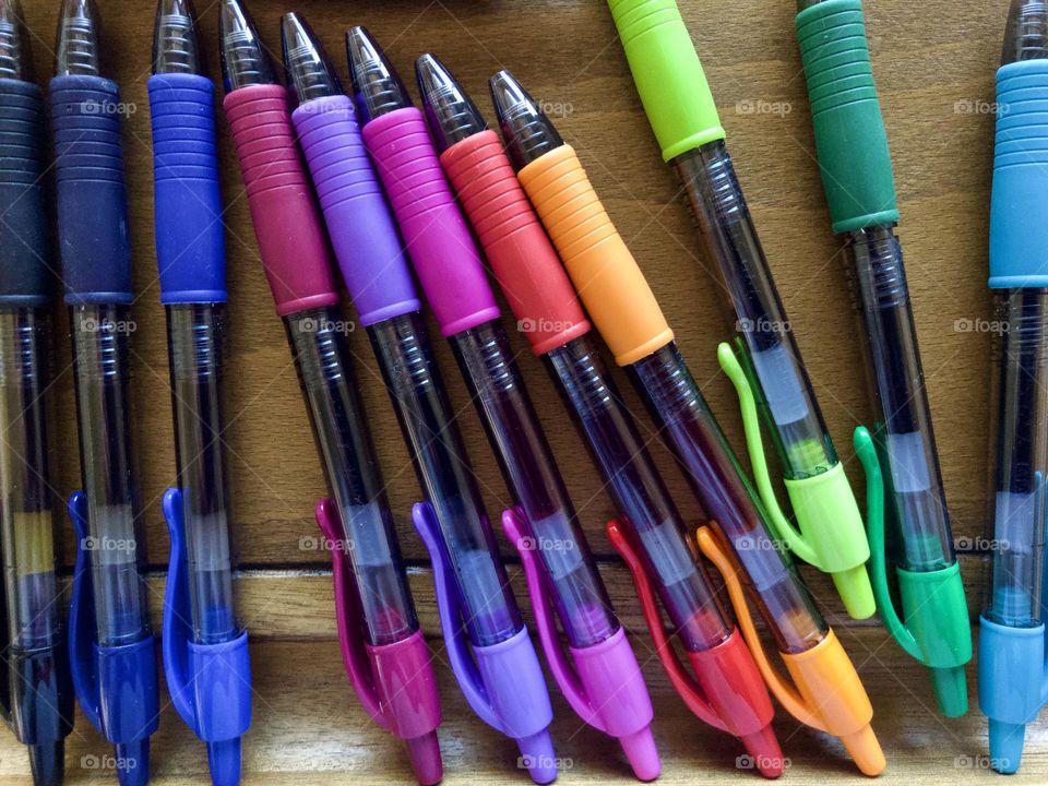 Overhead closeup of art supplies. Colorful pens create their own still life before use!