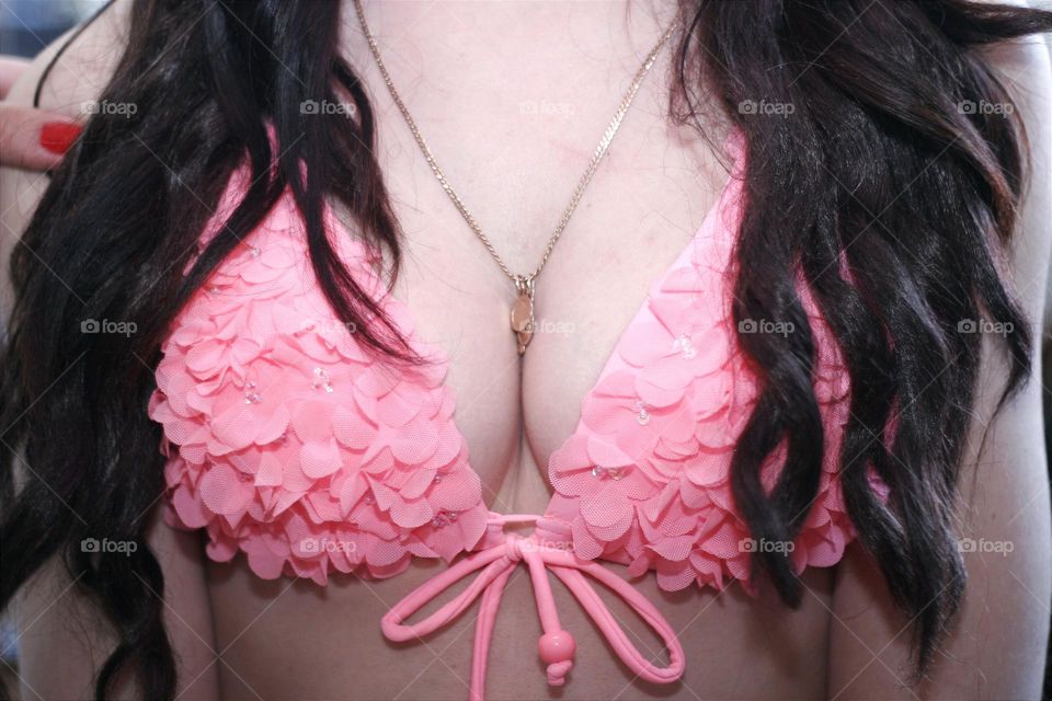 portrait of a beautiful girl's breasts with a gold chain