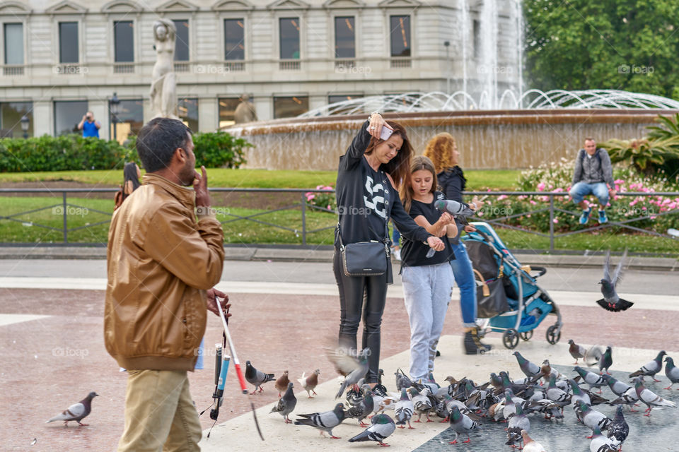 Selfie observed by a selfie sticks vendor