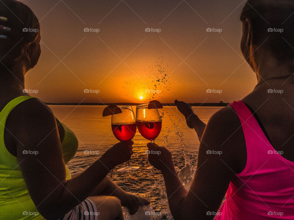 Glasses of wine at sunset