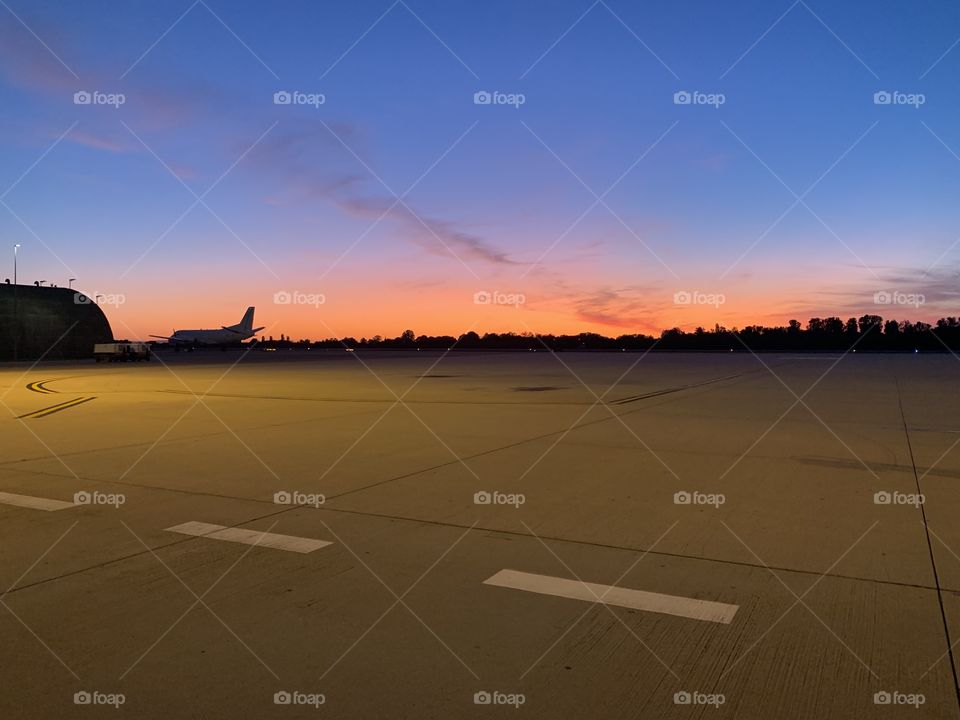 Outstanding sunset over a landing strip 
