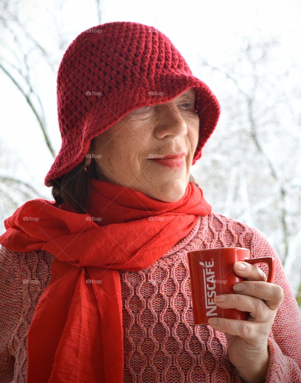 coffee cup in the women hands drinking coffee winter background