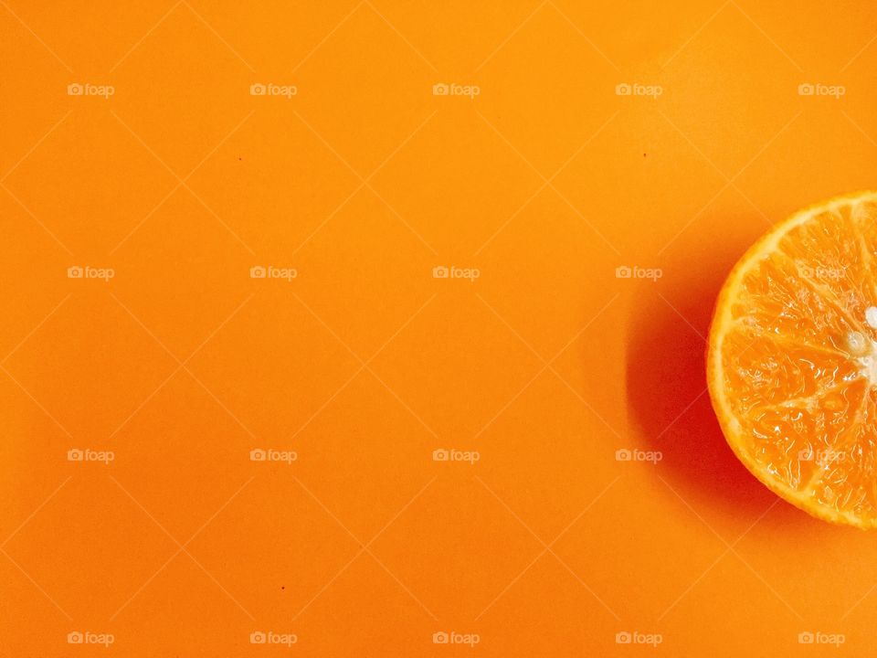 Fresh orange with orange background