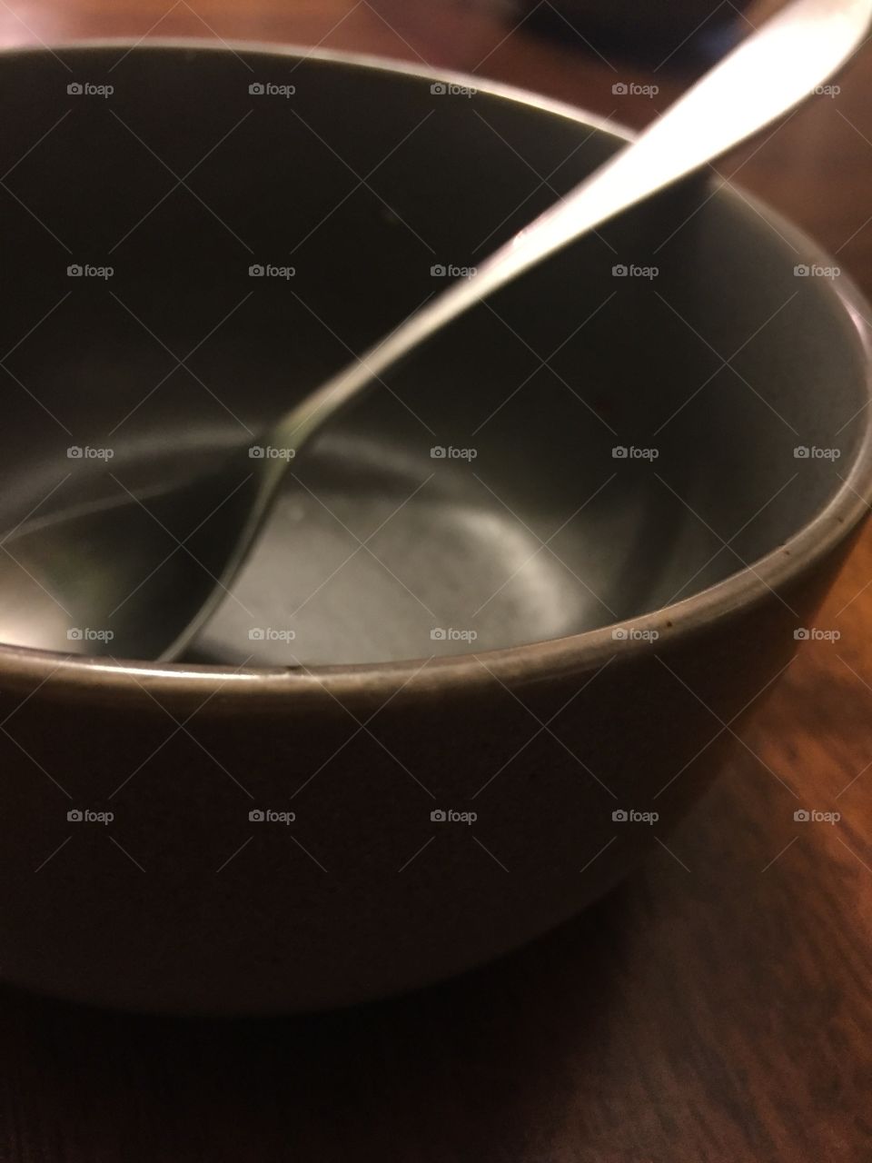 A Spoon in a Bowl on the Kitchen Table