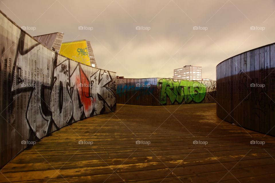 graffiti on wooden bridge