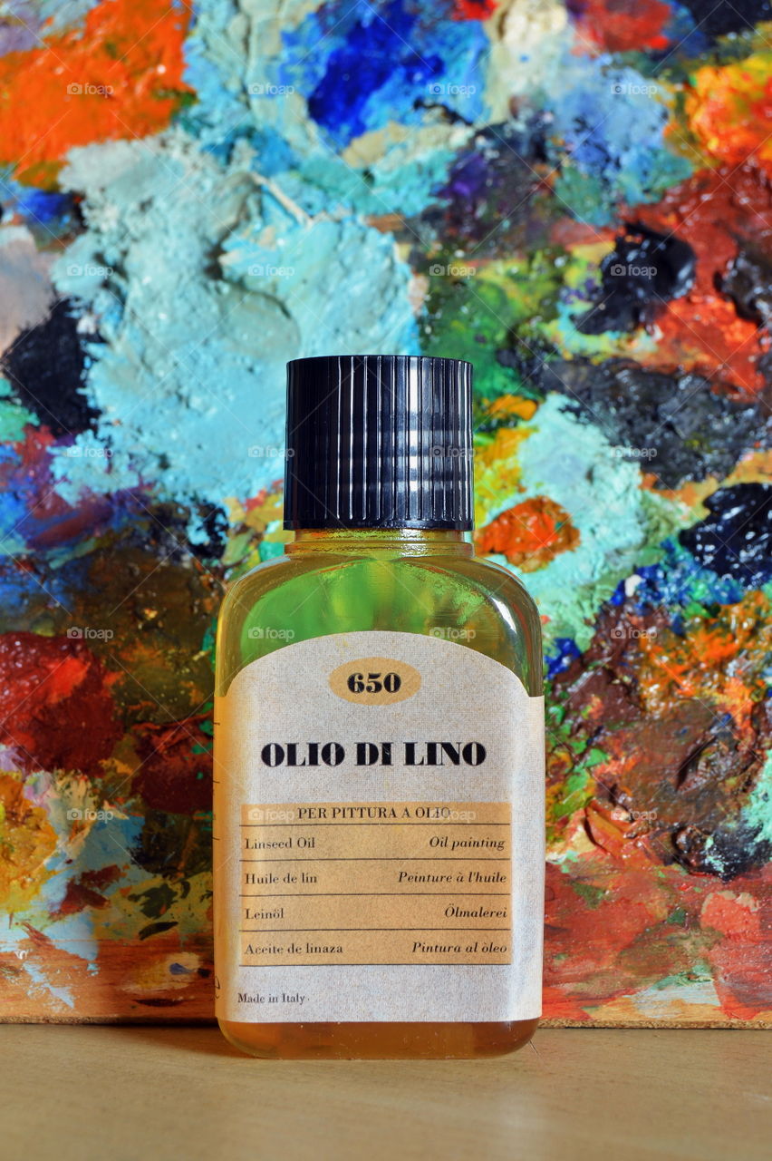 transparent container of diluent for oil colors