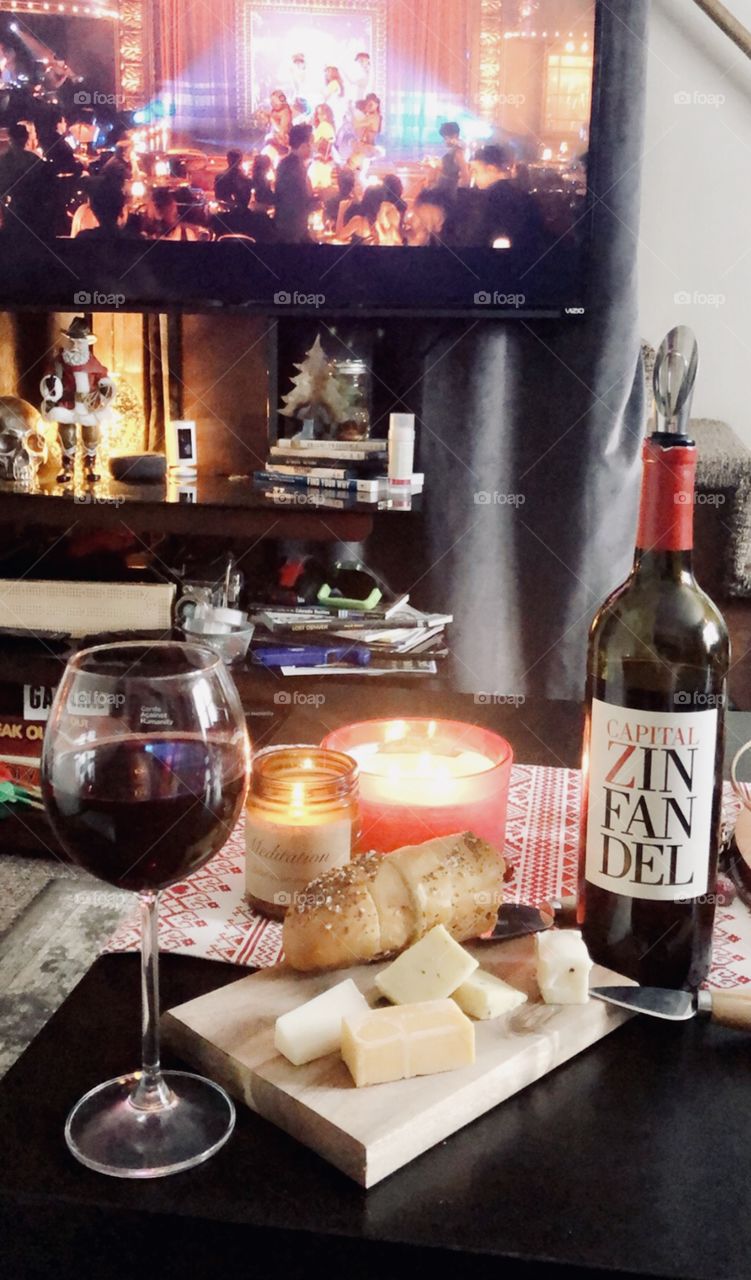 Delicious snack in on a cold day. Wine and cheeses complete with candles for ambiance. 