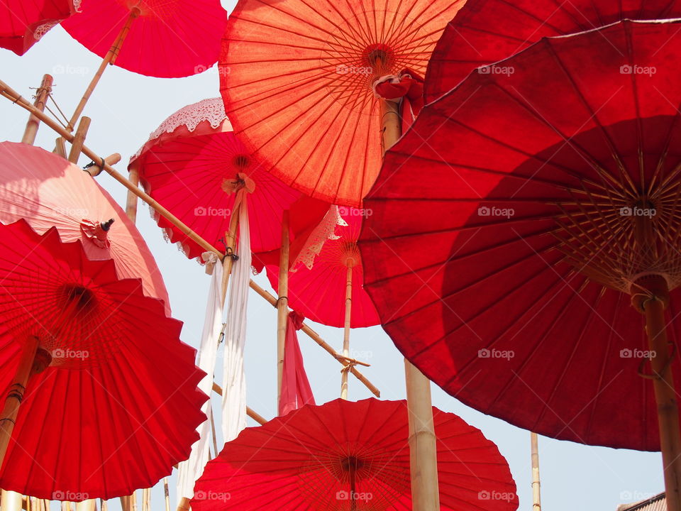 Red umbrellas in the sky