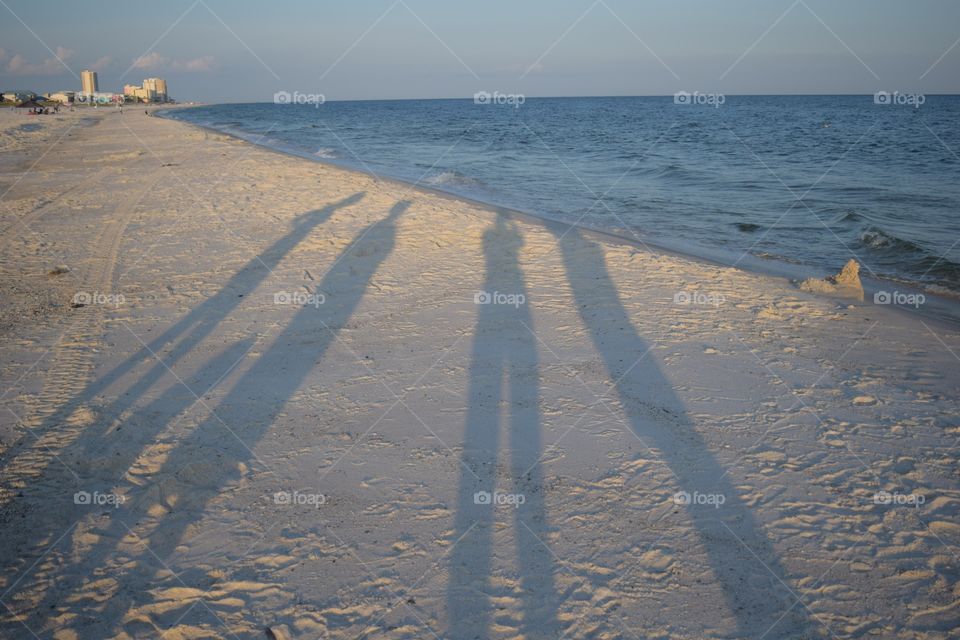 Shadows in the sand. Shadows on the beach
