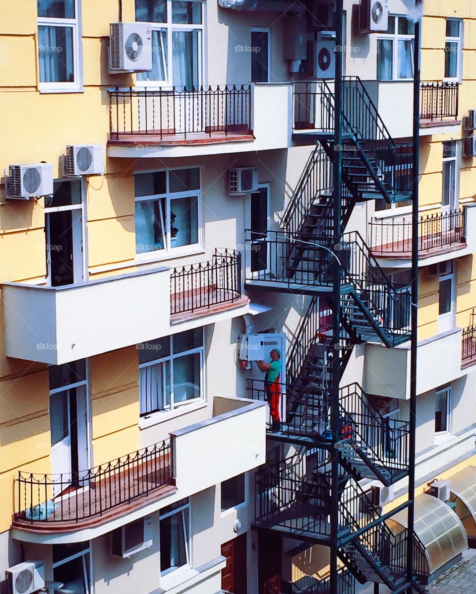 Front of the building with Windows, balconies and stairs