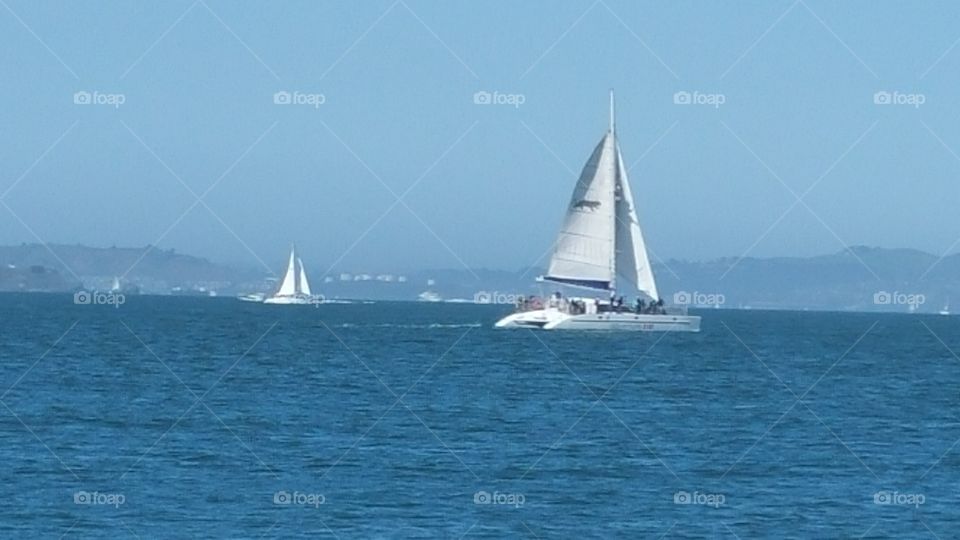 Ocean View with a Sailboat.